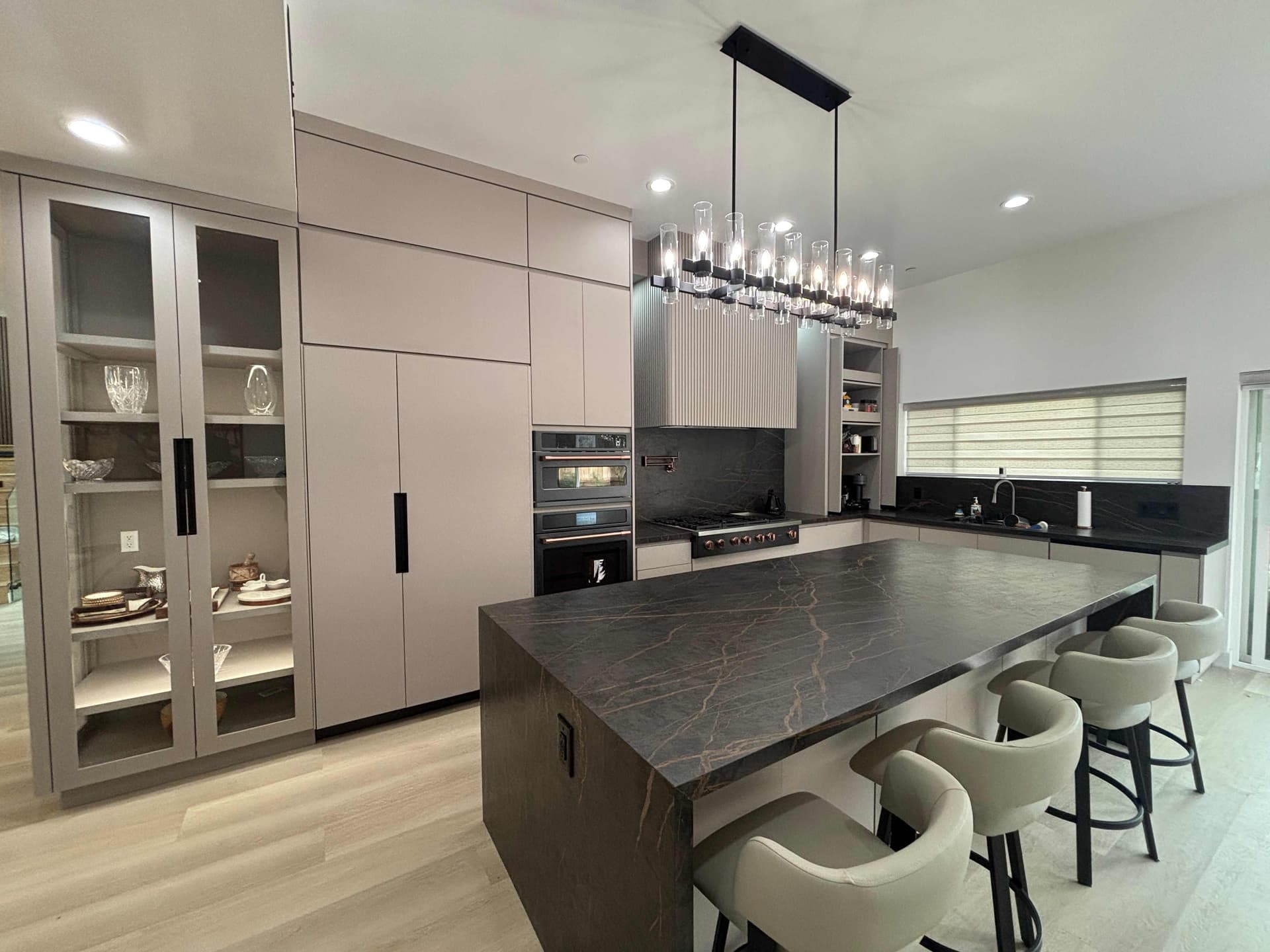 Custom kitchen cabinetry with wood finishes and an island